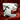 white bag of Gama roast on a dark red gradient background